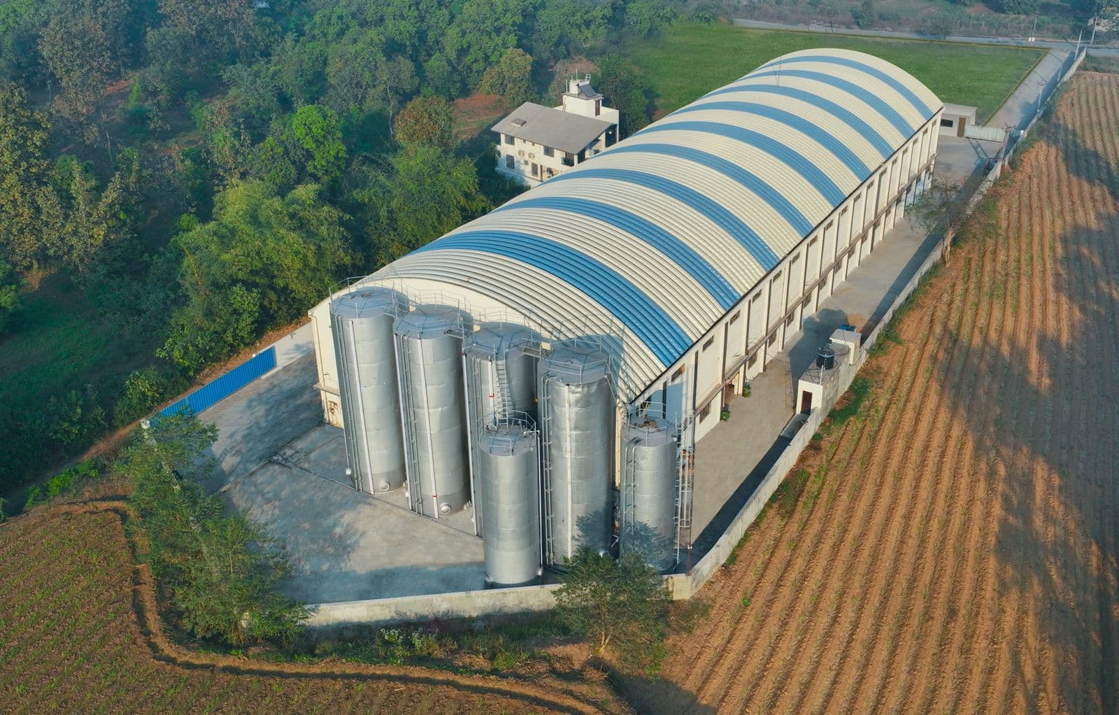 NISSANOL factory with storage silos