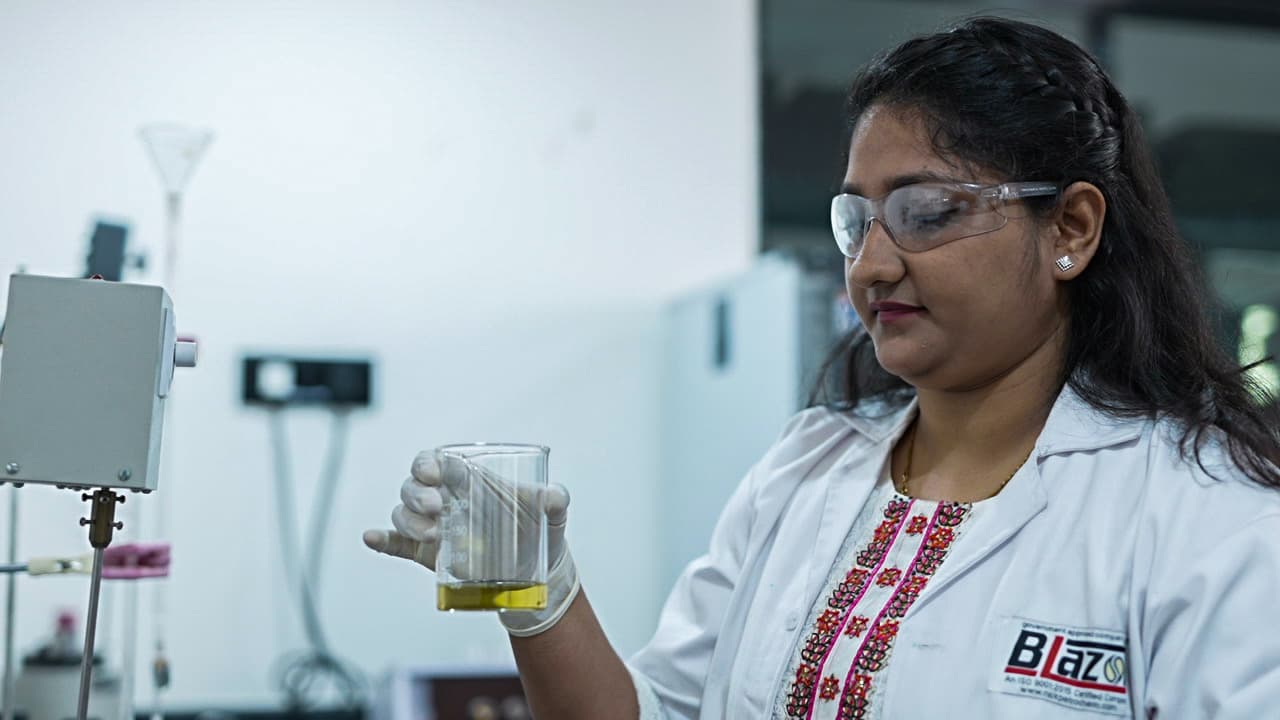 NISSANOL lab technician testing oil sample